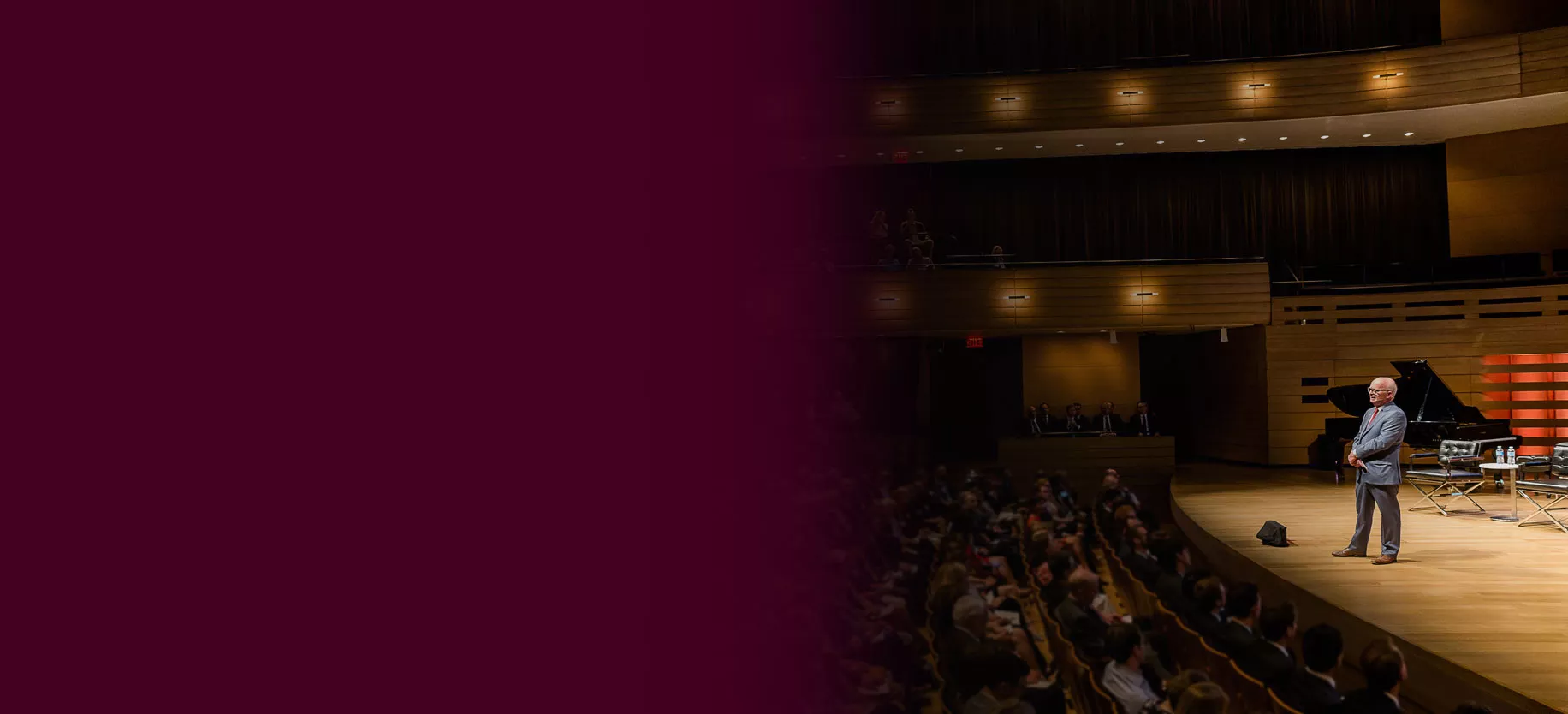 Tony Arrell onstage speaking at the annual Burgundy Forum