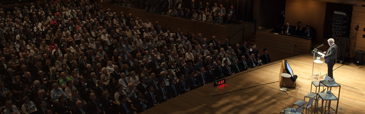 Richard Rooney speaking onstage at the annual Burgundy Forum