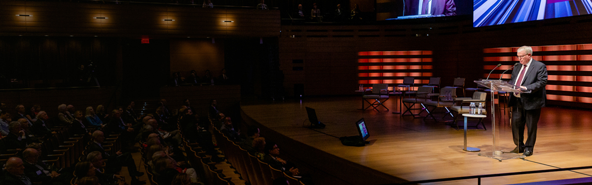 Richard Rooney speaking onstage at the annual Burgundy Forum