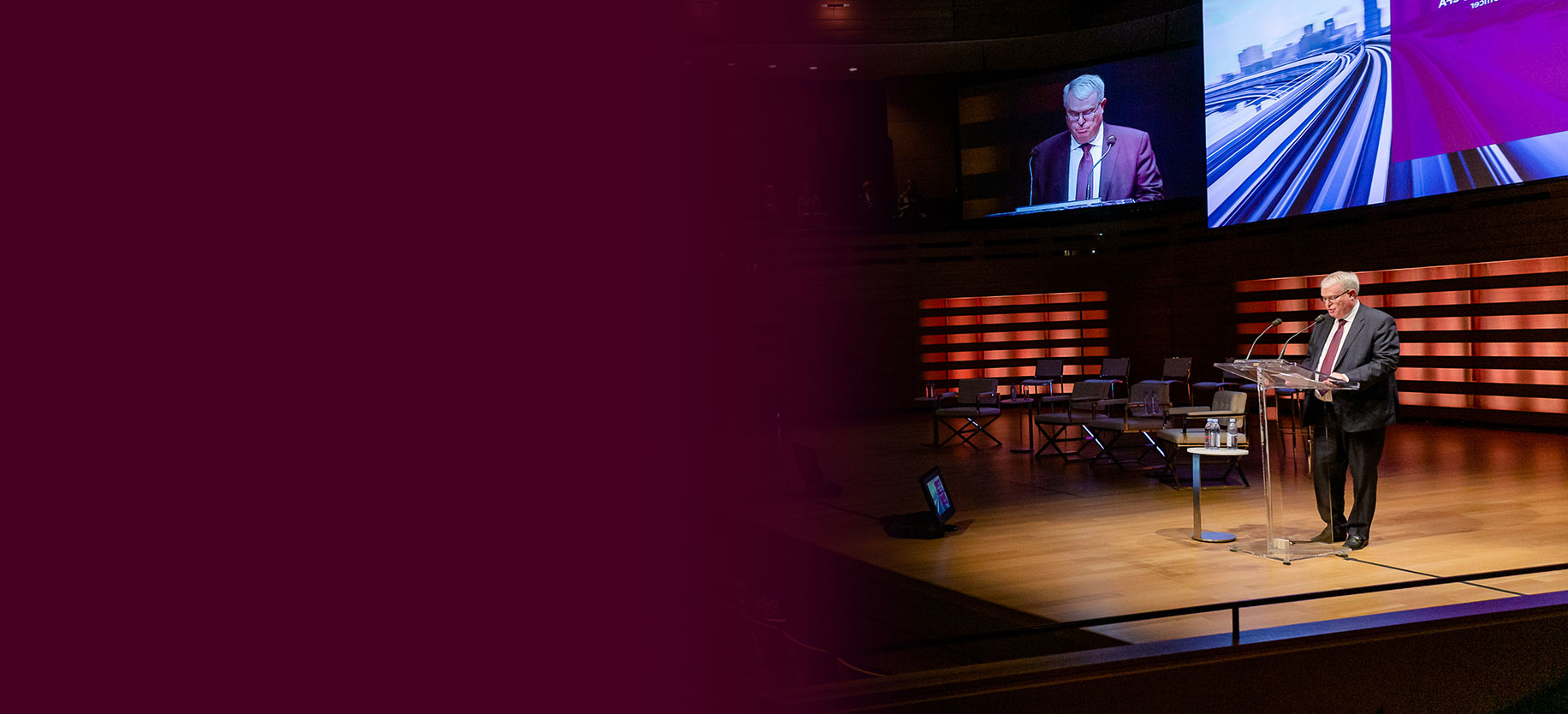 Richard Rooney speaking onstage at the Burgundy Forum