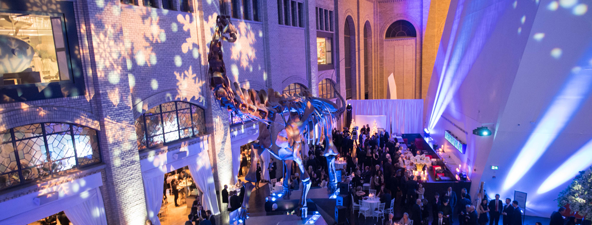 A dinosaur skeleton looms over the Burgundy Ball at the Royal Ontario Museum in Toronto