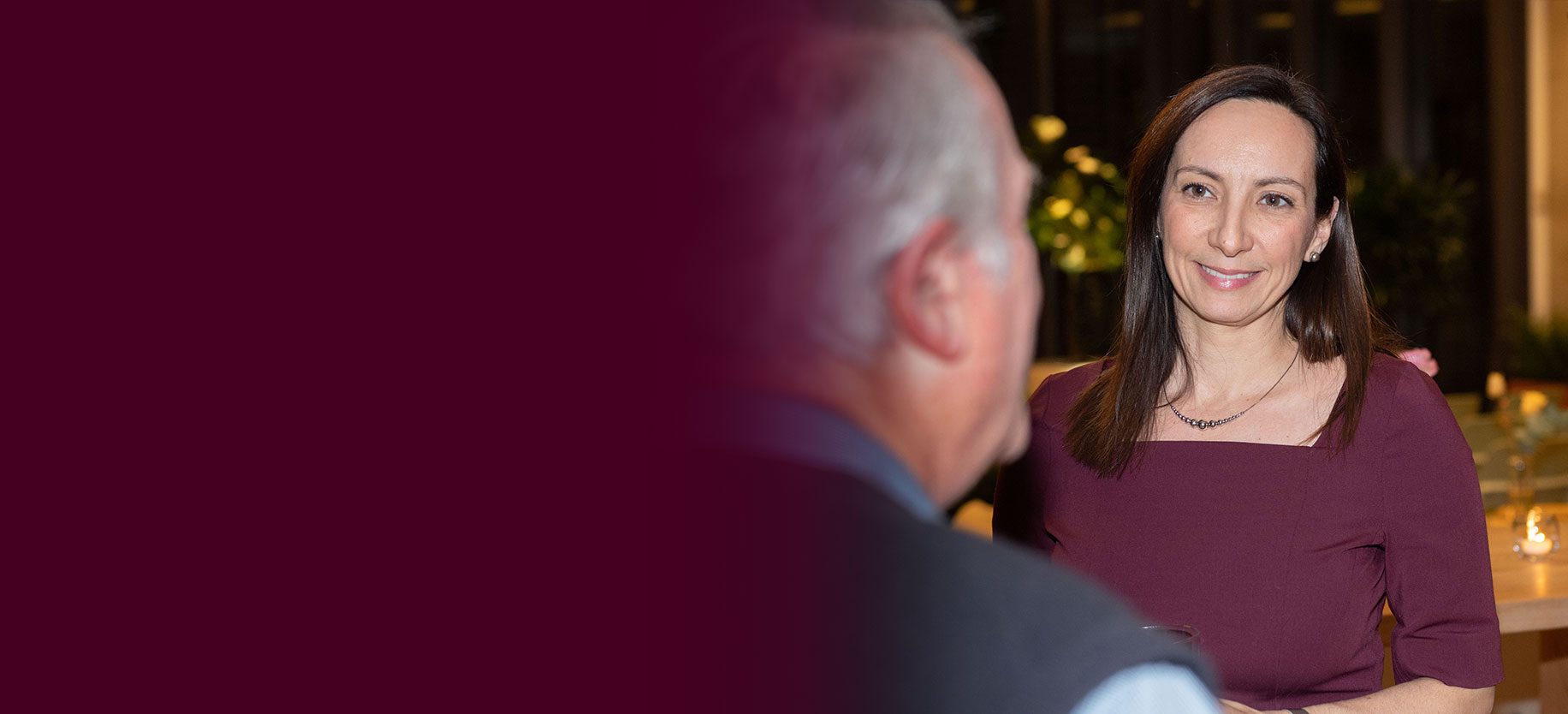 Julie Cordeiro in conversation with a client at a Burgundy event