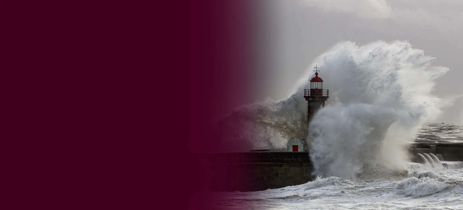 Wave crashing against lighthouse