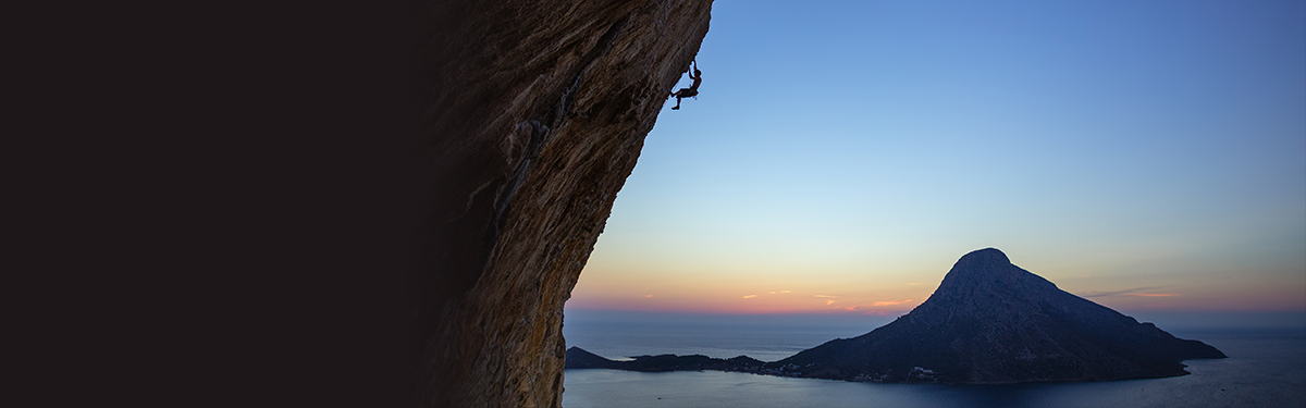 A person climbing a cliff