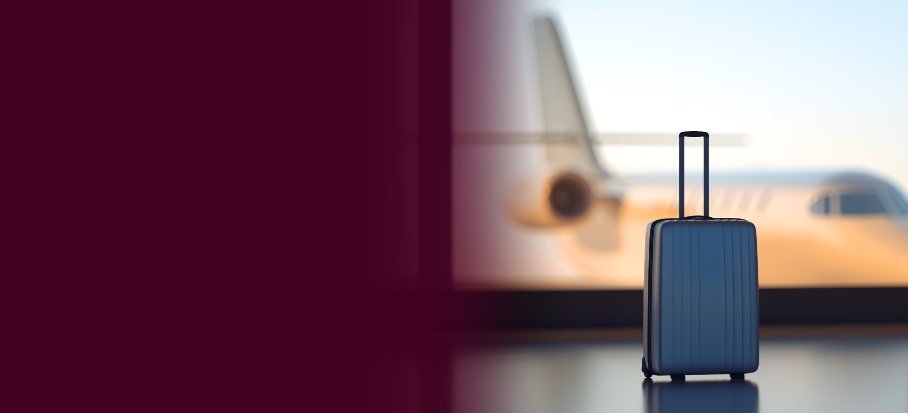 A suitcase in an airport with a plane visible through the window in the background