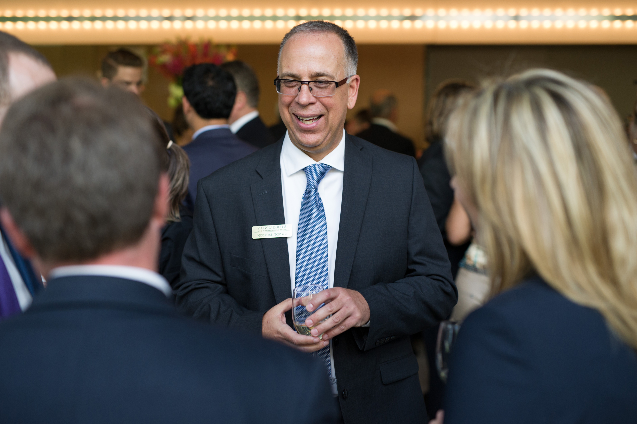 Randy Jackson speaking with clients at the Burgundy Forum