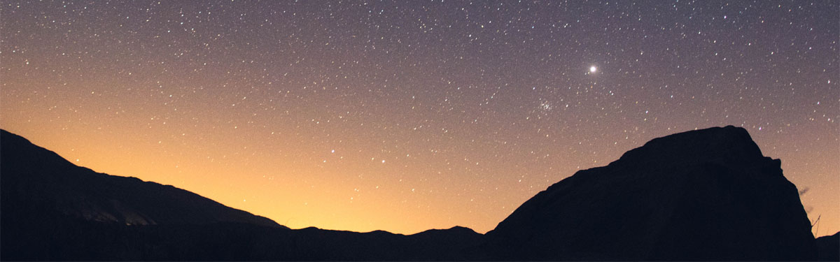 A mountain with a starry sky