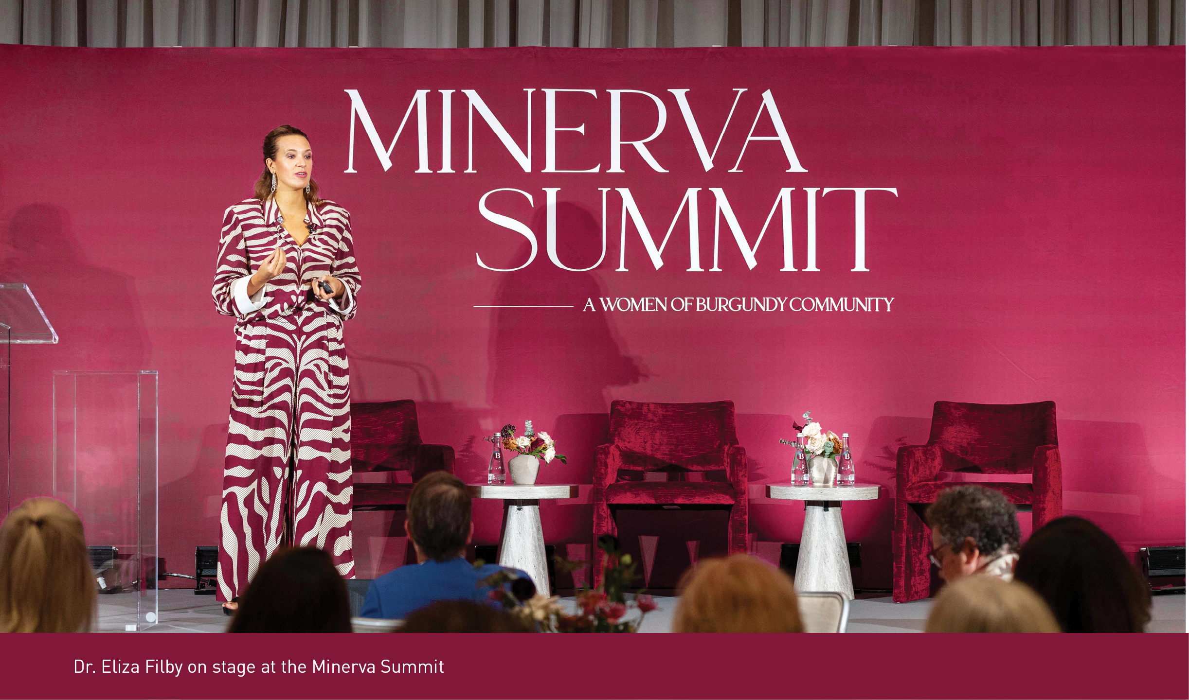 Dr. Eliza Filby on stage at the Minerva Summit