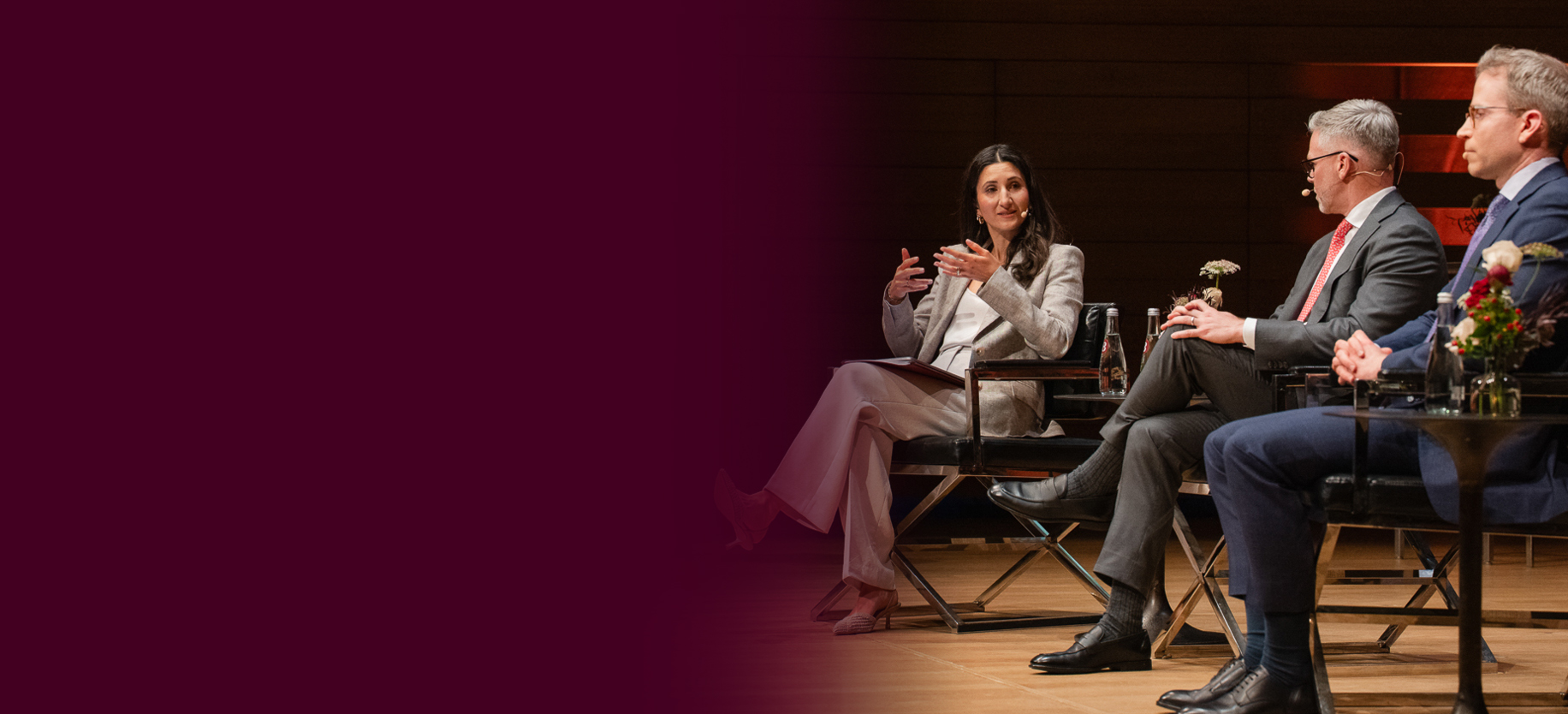 Lauren Davis Landau, Stephen Shuttleworth and Doug Winslow on stage at the Burgundy Forum
