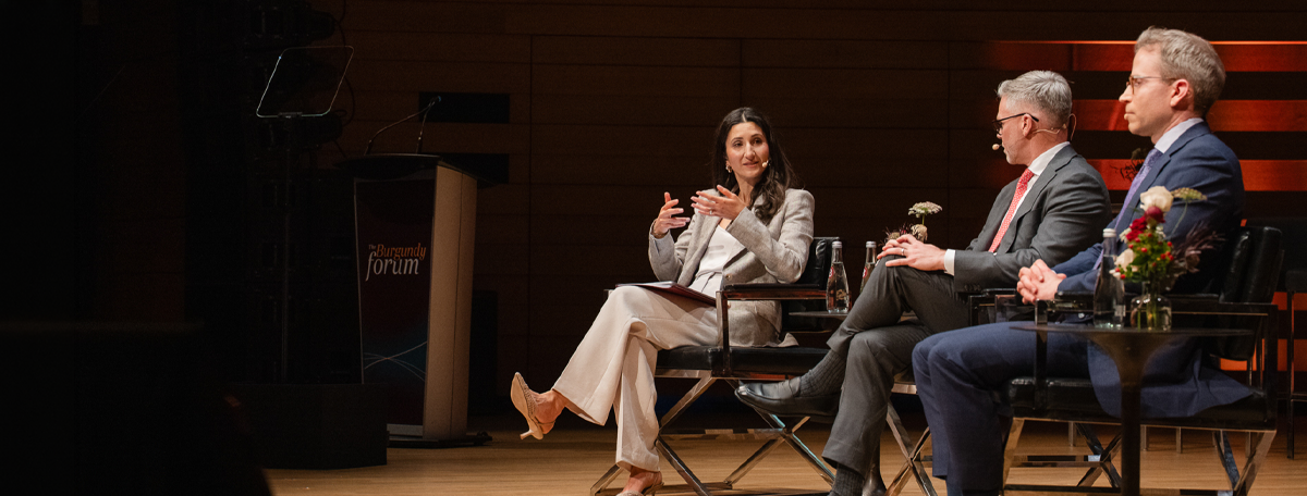 Lauren Davis Landau, Stephen Shuttleworth and Doug Winslow on stage at the Burgundy Forum