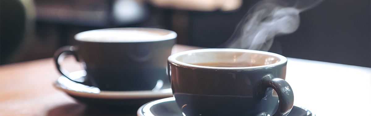 A pair of coffee cups on a table