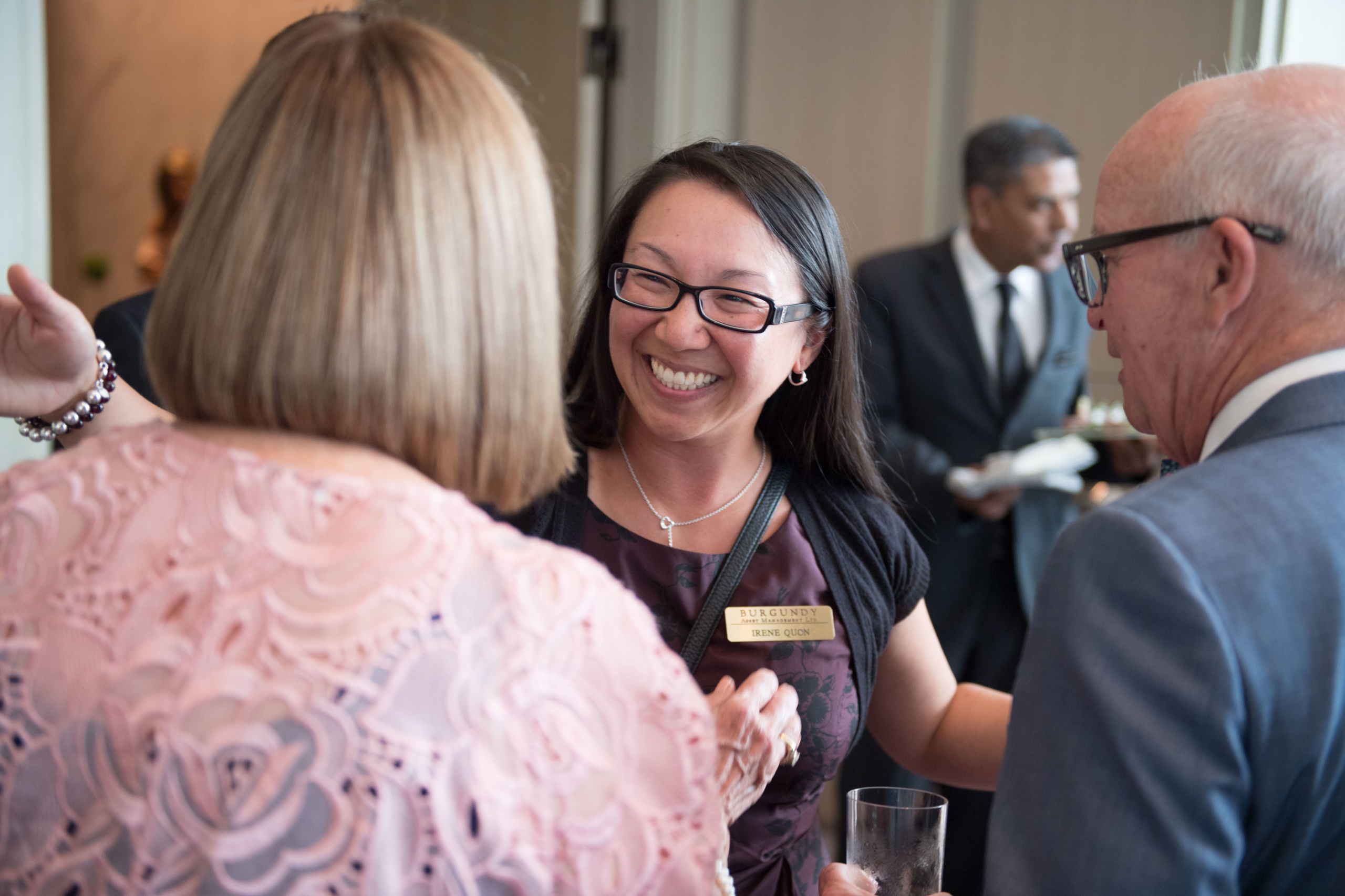 Irene Quon greets a guest at a Burgundy event