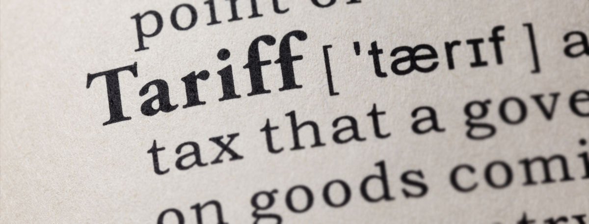 Close up of a dictionary entry defining the term 'Tariff'