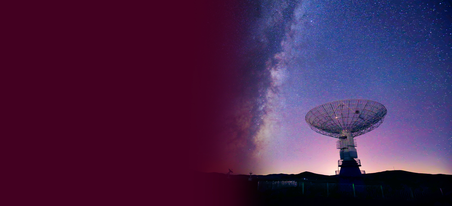 Radar dish pointed towards a night sky that is full of stars