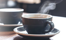 A pair of coffee cups on a table