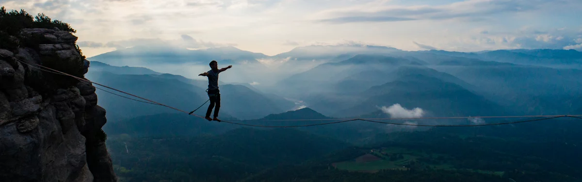 A person balancing on a slack line