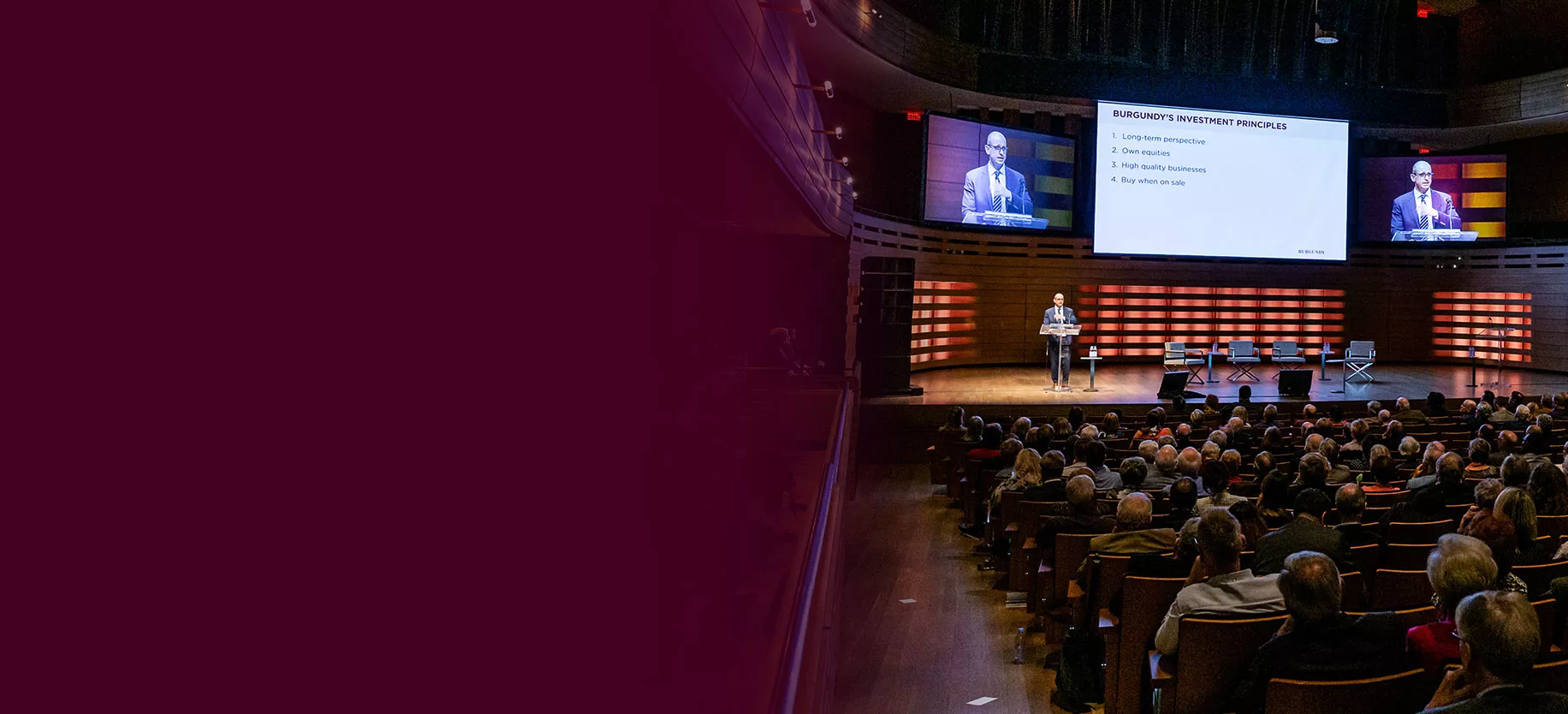 Rob Sankey speaking onstage at the Burgundy Forum in front of a crowd